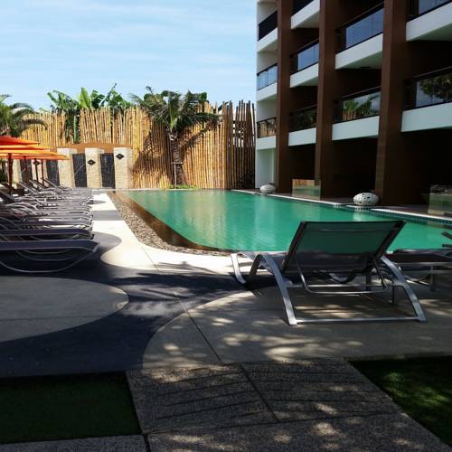 Фото 
The Beach Condo By White House
